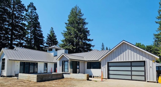 modern farmhouse style home featuring a garage