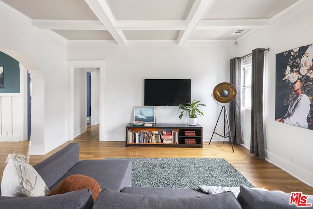 living room featuring beamed ceiling, hardwood / wood-style floors, and coffered ceiling