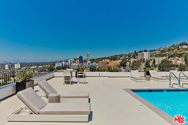 view of swimming pool featuring a patio