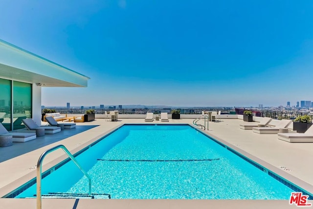 view of pool featuring a patio area