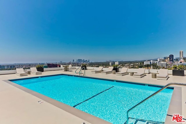 view of swimming pool with a patio