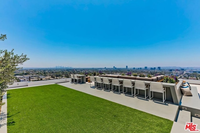 exterior space featuring exterior bar and a patio