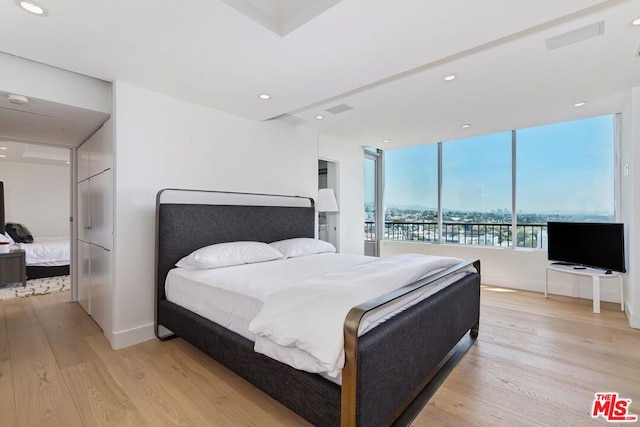 bedroom featuring light wood-type flooring