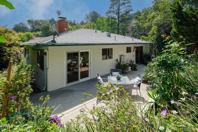 back of property featuring a patio