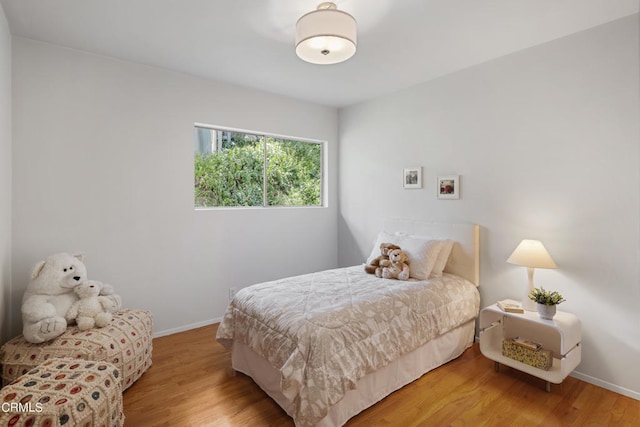 bedroom with light hardwood / wood-style flooring