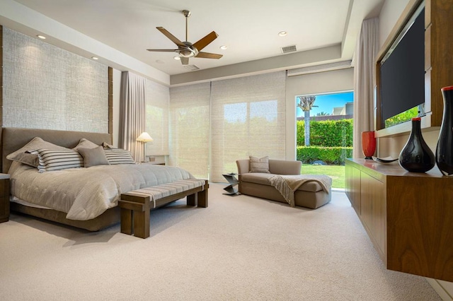 carpeted bedroom featuring ceiling fan and access to exterior