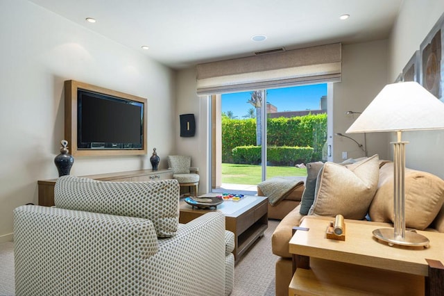 living room featuring light carpet