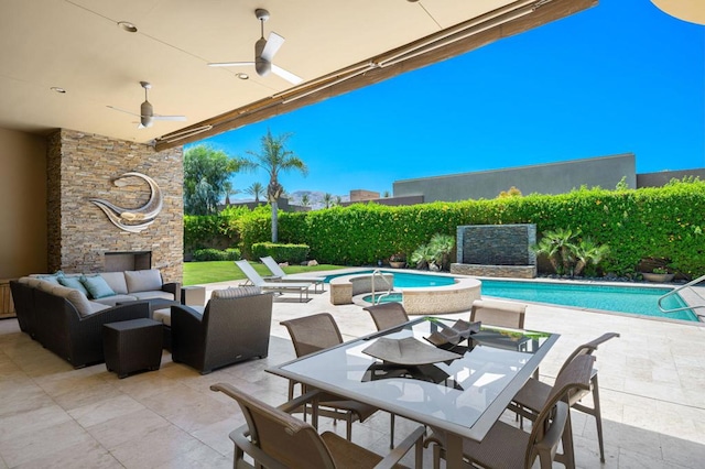 view of patio / terrace with a swimming pool with hot tub, an outdoor hangout area, and ceiling fan