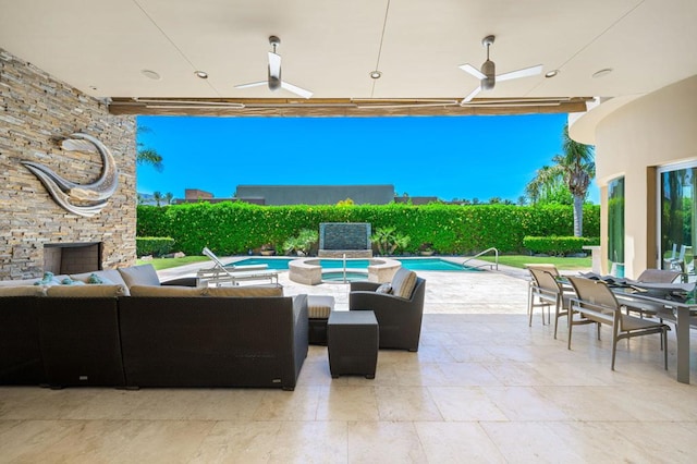 view of patio / terrace featuring a fenced in pool, ceiling fan, and an outdoor hangout area