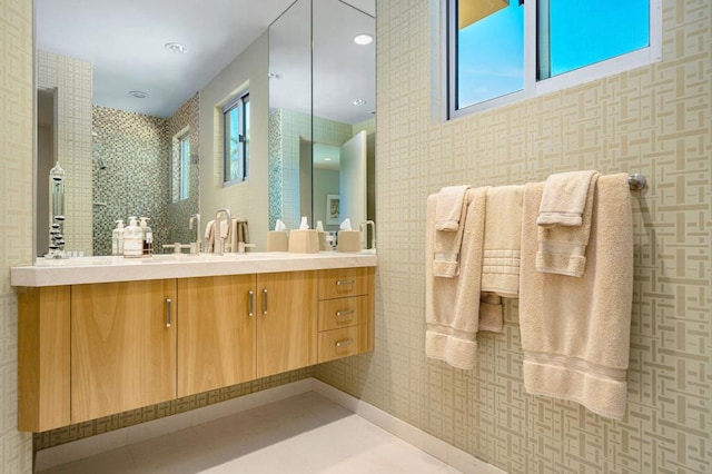 bathroom featuring vanity and a shower