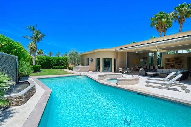 view of swimming pool featuring a patio, outdoor lounge area, an in ground hot tub, and ceiling fan