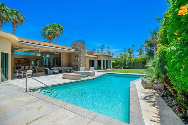 view of swimming pool featuring ceiling fan, a patio area, and outdoor lounge area