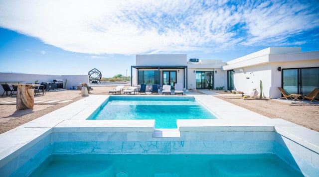 view of swimming pool with a patio