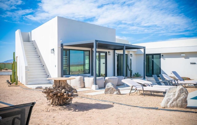 rear view of house with a patio