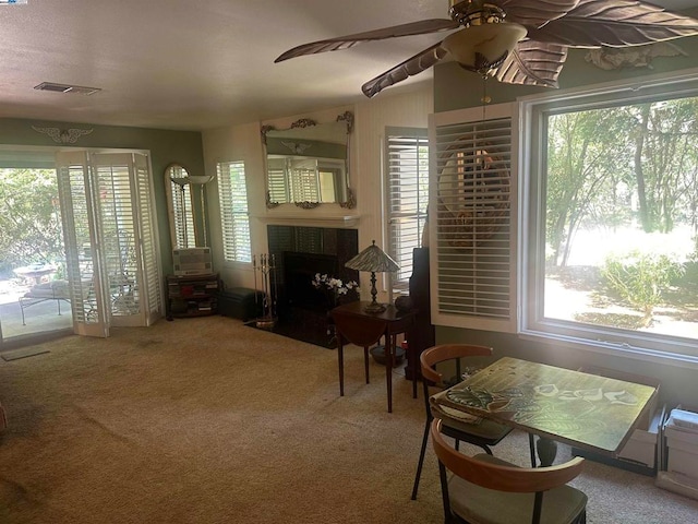 living room featuring ceiling fan and carpet floors