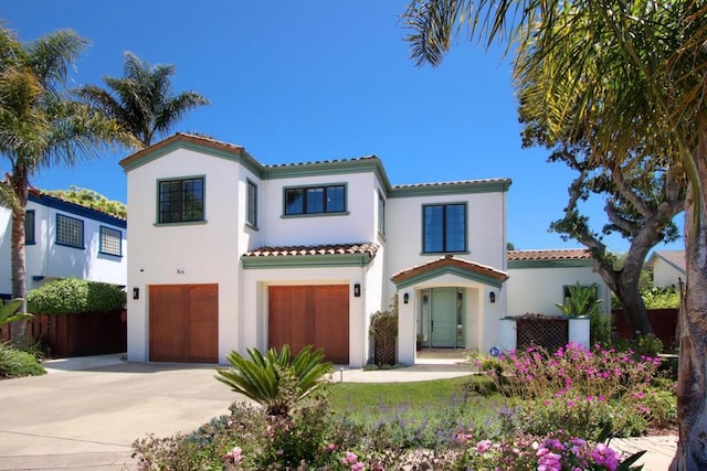 mediterranean / spanish-style house featuring a garage