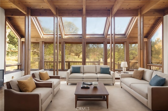 sunroom / solarium with vaulted ceiling with skylight and wooden ceiling