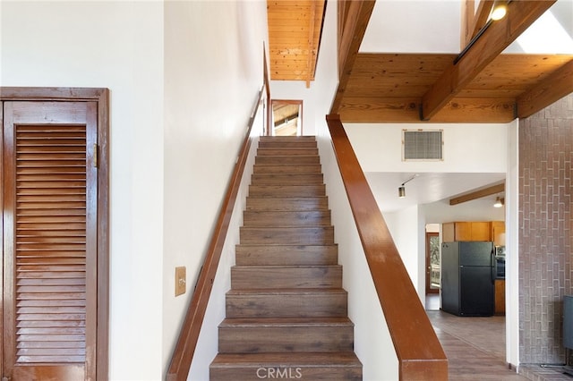 stairway with beam ceiling