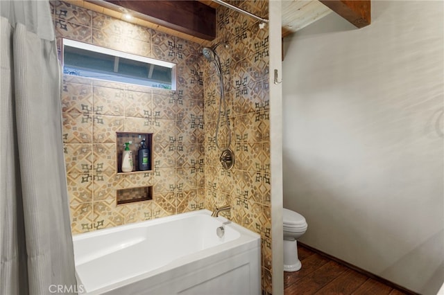 bathroom with hardwood / wood-style floors, shower / bath combo, and toilet