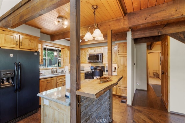 kitchen with beam ceiling, butcher block countertops, pendant lighting, black appliances, and wood ceiling