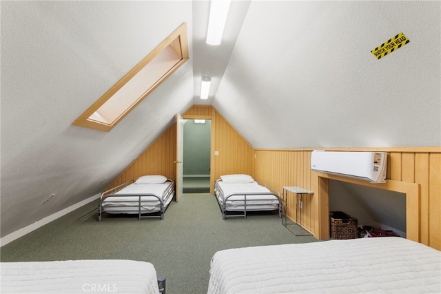 carpeted bedroom with a textured ceiling, lofted ceiling with skylight, and wooden walls