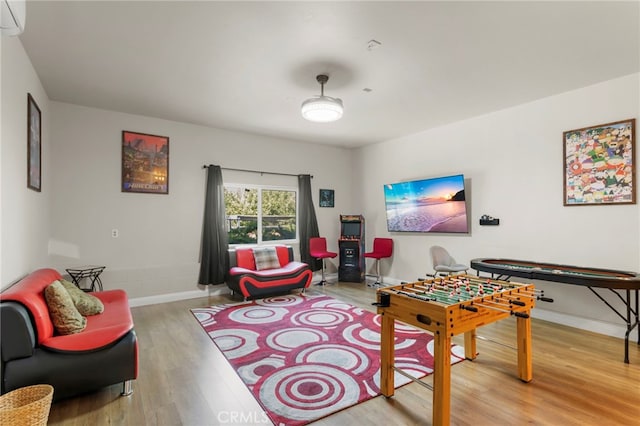 game room with hardwood / wood-style floors