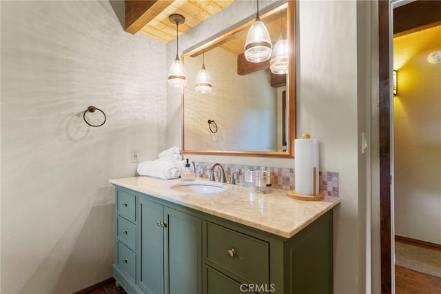 bathroom featuring hardwood / wood-style floors, vanity, wooden ceiling, and beam ceiling