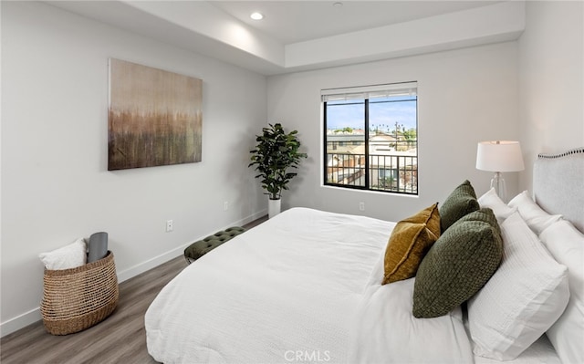 bedroom with hardwood / wood-style flooring