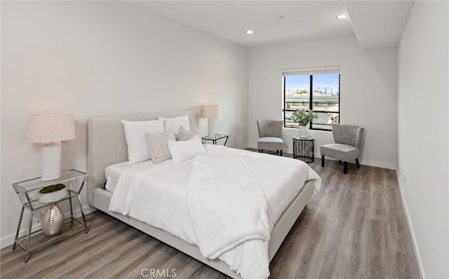 bedroom with wood-type flooring