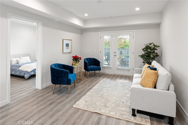 sitting room with french doors and hardwood / wood-style floors