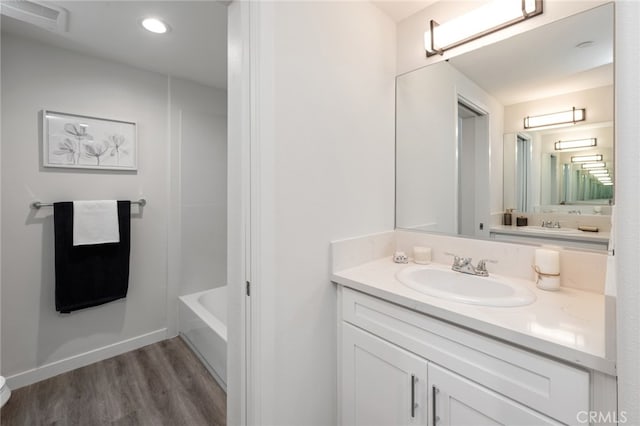 bathroom with wood-type flooring and vanity