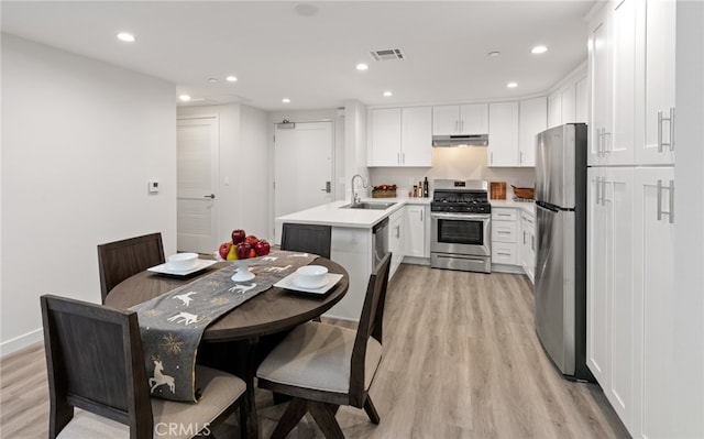 interior space with sink and light hardwood / wood-style floors