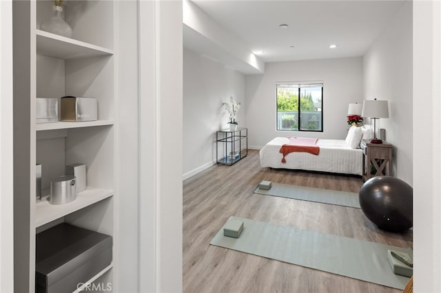 bedroom with light wood-type flooring