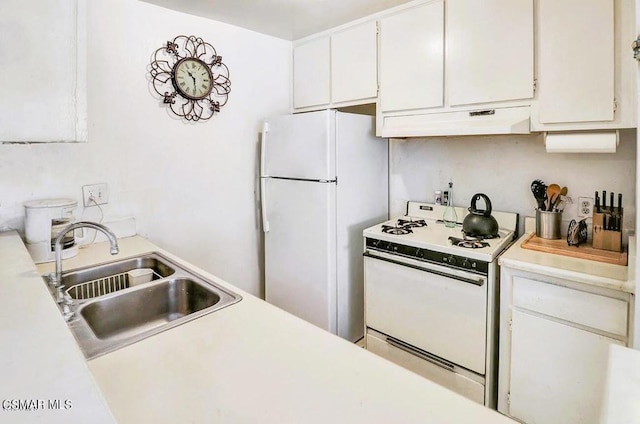 kitchen with white cabinetry, sink, and white appliances