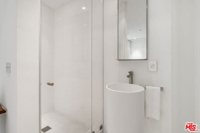 bathroom with an enclosed shower