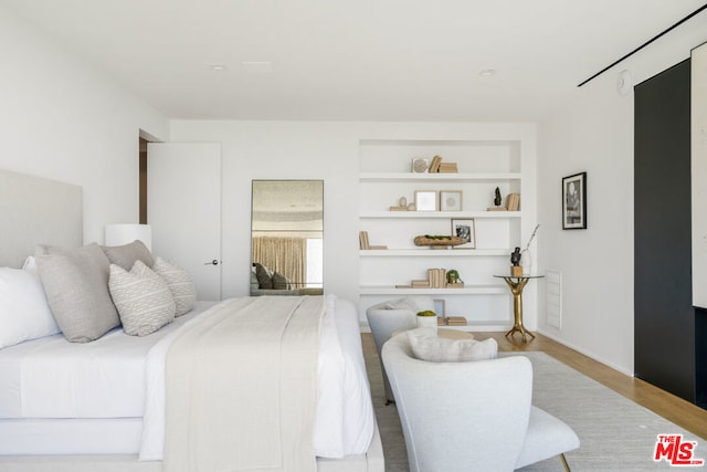 bedroom with light wood-type flooring