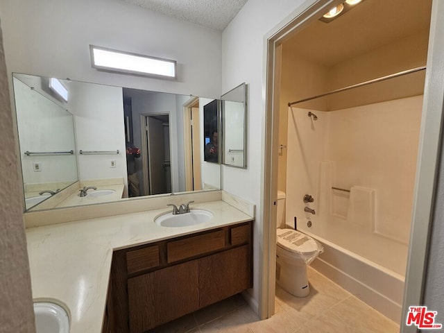 full bathroom with tile flooring, vanity, toilet, and bathtub / shower combination