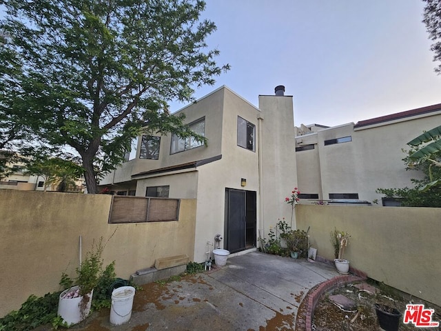 back of house featuring a patio