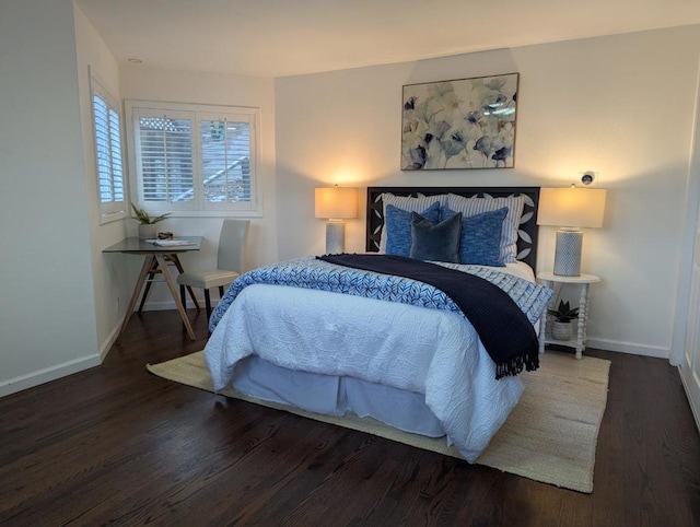 bedroom with dark wood-type flooring