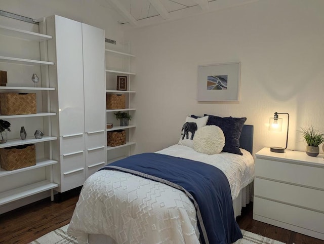 bedroom featuring dark hardwood / wood-style flooring