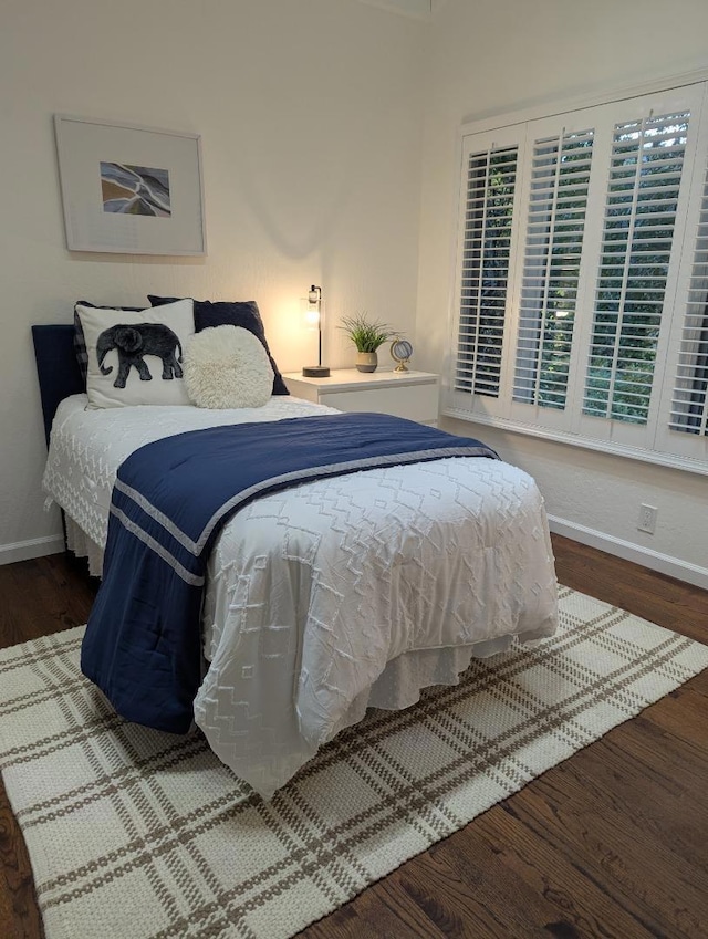 bedroom featuring dark hardwood / wood-style flooring