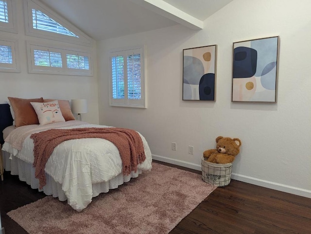 bedroom with dark hardwood / wood-style floors and lofted ceiling with beams