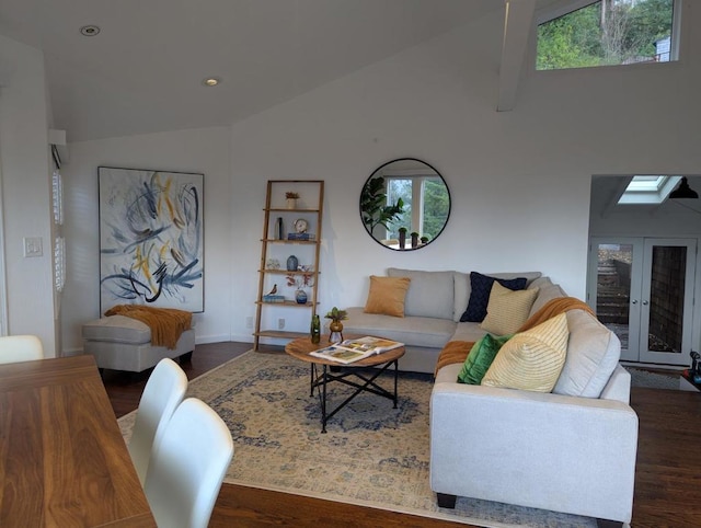 living room with vaulted ceiling, dark wood-type flooring, a healthy amount of sunlight, and french doors