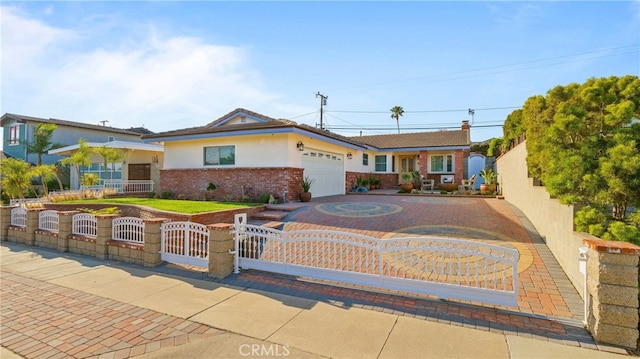 ranch-style home featuring a garage