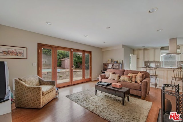 living room with light hardwood / wood-style floors