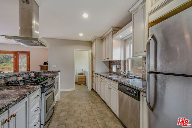 kitchen with tasteful backsplash, stainless steel appliances, extractor fan, sink, and dark stone countertops