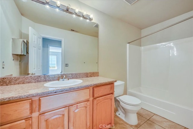 full bathroom with tile patterned flooring, shower / tub combination, vanity, and toilet