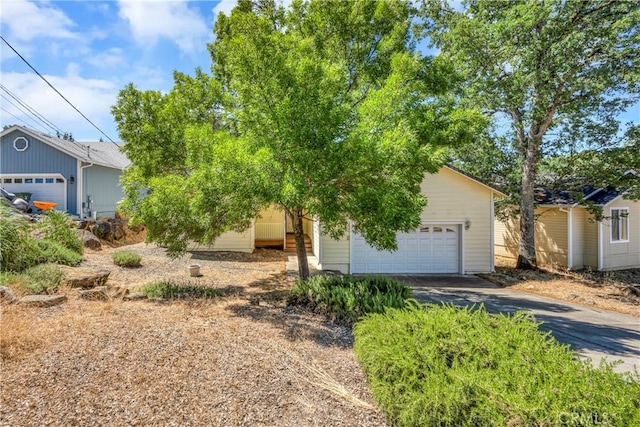 view of front of property with a garage and an outdoor structure