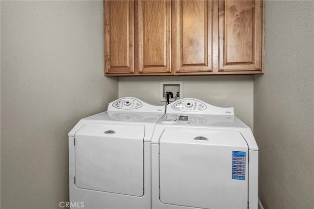 laundry area featuring cabinets and washer and dryer