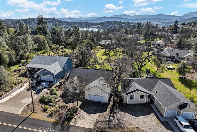 birds eye view of property with a mountain view